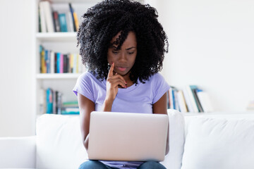 Video call or conference at computer of african american woman in quarantine