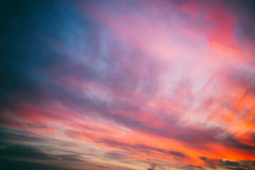 Bright amazing amazing sunset sky with blurry clouds, abstract nature background and texture