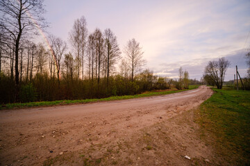 dramatatic red dark sunset over the fields and cities