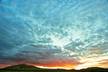 Evening cloudy sky over the sand dunes.