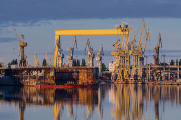 SHIPYARD - Floating dock, gantry and cranes on repair quays
