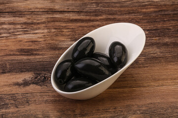 Pickled black olives in the bowl