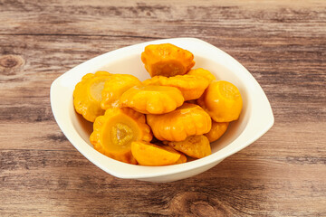 Marinated yellow patisson in the bowl
