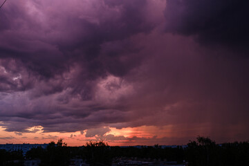 dramatatic red dark sunset over the fields and cities