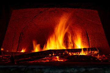 firewood burning in the pizza oven
