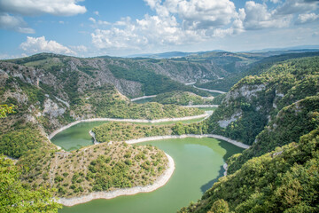 Fototapeta na wymiar View of the river in the mountains. View of the beautiful meanders of Uvac