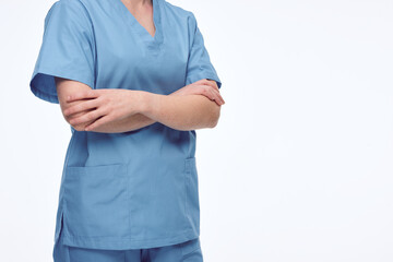 nurse with crossed arms look to the right. no face