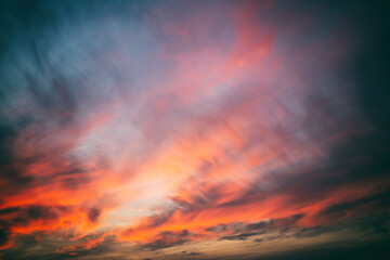 Bright amazing amazing sunset sky with blurry clouds, abstract nature background and texture