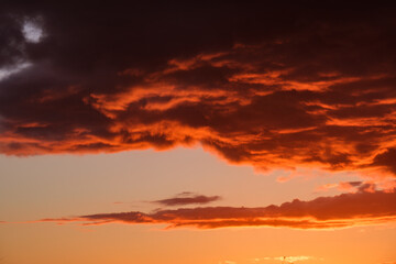 dramatatic red dark sunset over the fields and cities