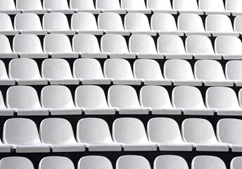 Gray plastic chairs at thetribune football stadium