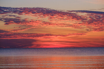 dramatatic red dark sunset over the fields and cities