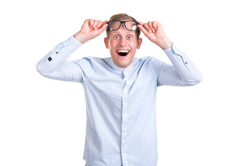 Wow, blimey! Young surprised man raised his glasses up in surprise, isolated on white background.