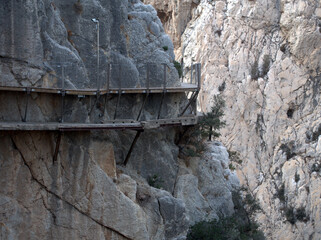 Fototapeta premium The Caminito del Rey is a pass built into the walls of the Gaitanes Gorge, Malaga. It is a pedestrian footbridge of more than three kilometers . with sections of a width of just one meter