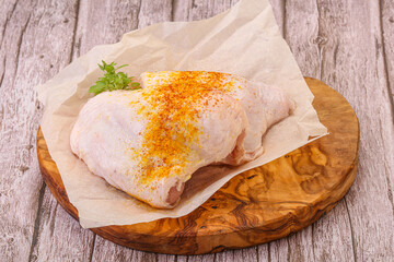 Raw chicken thigh with spices