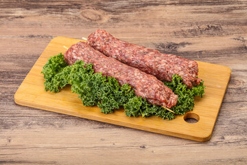 Raw minced beef kebab skewer