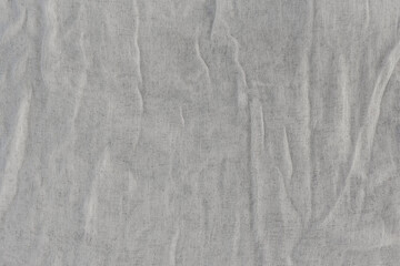 The texture of the gauze-type fabric. White thin fabric as a natural background.