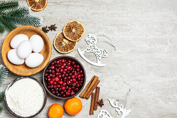Christmas baking ingredients on light marble table top view. copy space for your design. Christmas menu template.
