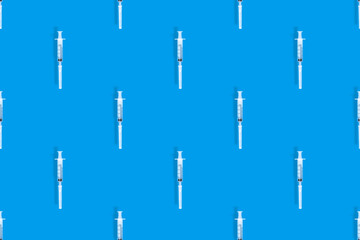 Seamless patterns. Medical syringes seamless pattern. Medical syringes background.