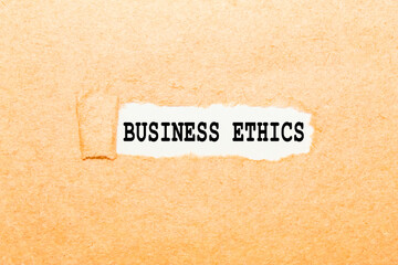 Fototapeta na wymiar text BUSINESS ETHICS on a torn piece of paper, business concept