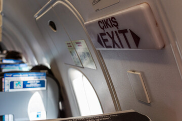 Exit door sign in an airplane.