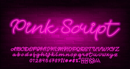 Pink Script alphabet font. Pink neon light letters, numbers and symbols. Brick wall background. Stock vector typescript for your design. © epifantsev