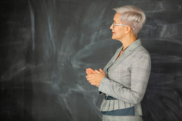 beautiful adult female in a suit near the board