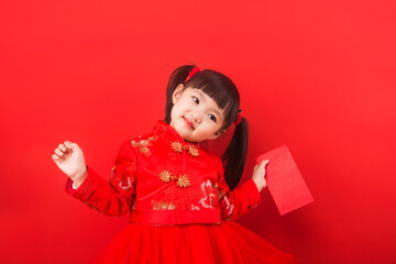 A Chinese girl celebrates Chinese New Year with a red envelope