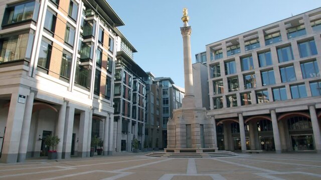 Lockdown in London, beautiful completely empty Paternoster Square monument in golden morning sunrise light and blue sky's, during the COVID-19 pandemic 2020.