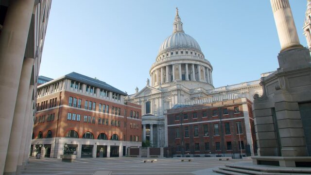 Lockdown in London, stunning St Pauls Cathedral revealed in beautiful morning sunlight from deserted Paternoster Square, during the COVID-19 pandemic 2020.