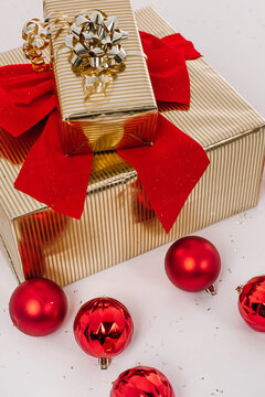 christmas items golden box red bow balls