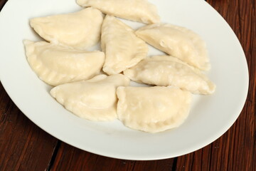 Fototapeta na wymiar Cooked Dumplings on plate