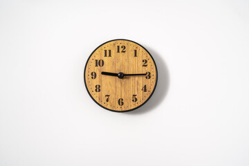 wood office wall clock with white dial on white background. wall clock on white background, top...