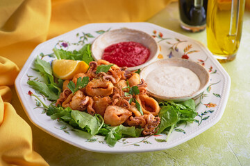 pile of deep fried baby octopus, seafood for beer on a platter