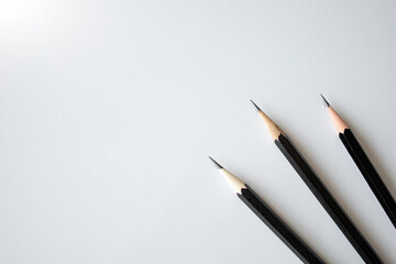 back to school concept, black pencil on white table background