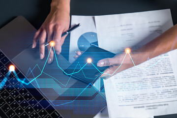 Financial chart hologram and a woman signing contract use phone. Double exposure. Analysis concept.