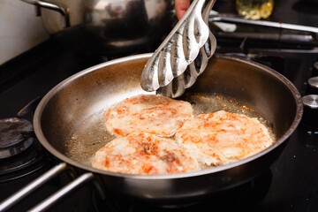 Frying the burgers in the turkey breast burger pan