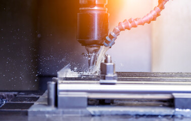 CNC milling machine drills holes in the pipe.