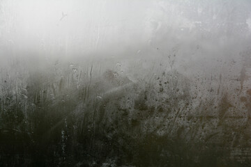 Looking through the glass of the car during a thunderstorm in autumn, in the background Italian countryside