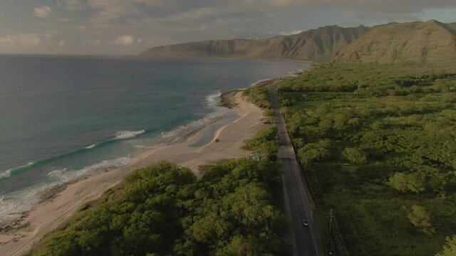 Drone footage of Beetle driving in Hawaii during sunset. Shot on Oahu's west coast near Keawaula Beach. Shot on DJI Mavic 2 Zoom.