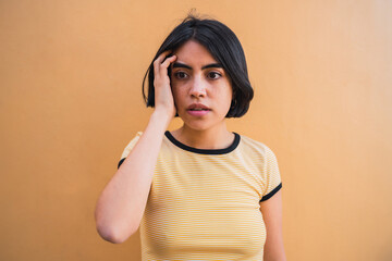 Fototapeta premium Young beautiful woman with shocked expression.