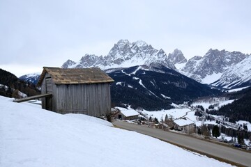 Winter mountain view with traditional wooden rural building from area around Monte Elmo/Helm in Dolomites, Italy, Puster Valley/Alta Pusteria, South Tyrol.