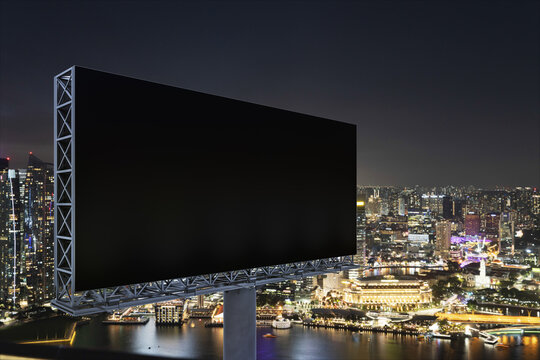 Blank black road billboard with Singapore cityscape background at night time. Street advertising poster, mock up, 3D rendering. Side view. The concept of marketing communication to sell idea.
