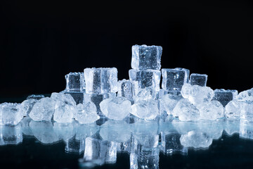 ice cubes and crushed ice on a black background