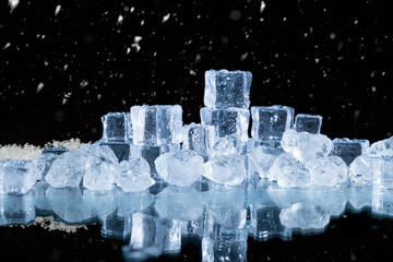 ice cubes and crushed ice on a black background