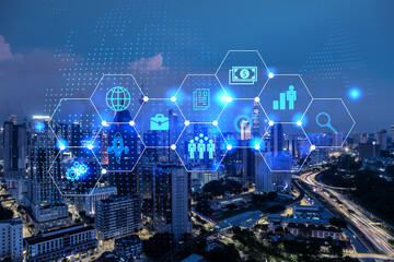 Research and technological development glowing icons. Night panoramic city view of Kuala Lumpur. Concept of innovative activities expanding new services or products in Malaysia, Asia. Double exposure.