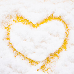yellow heart in the snow
