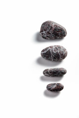 Composition of pebbles on a white background