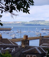 boats in the harbor with roofs