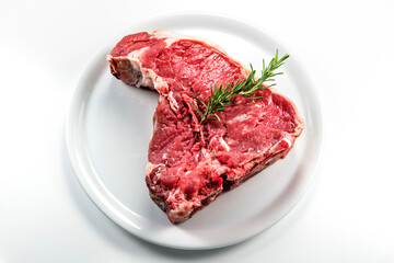 Raw T-bone steak with rosemary