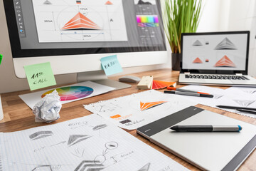 Graphic designer drawing sketches logo design.